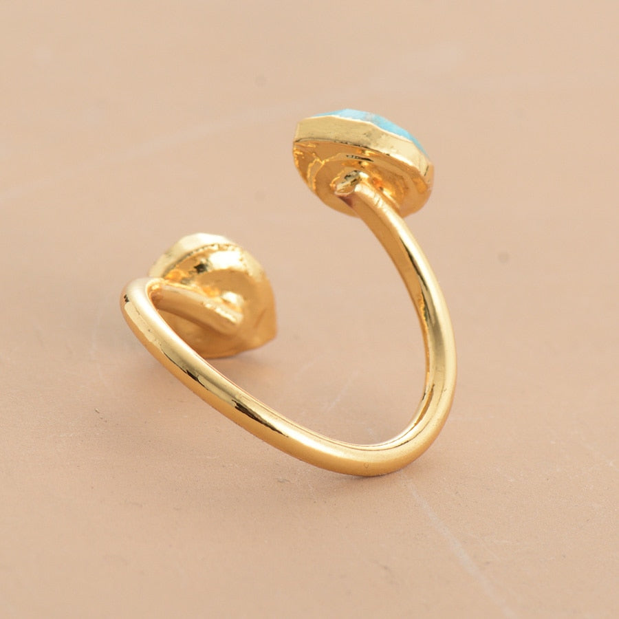 Anillo Dorado con Doble Turquesa